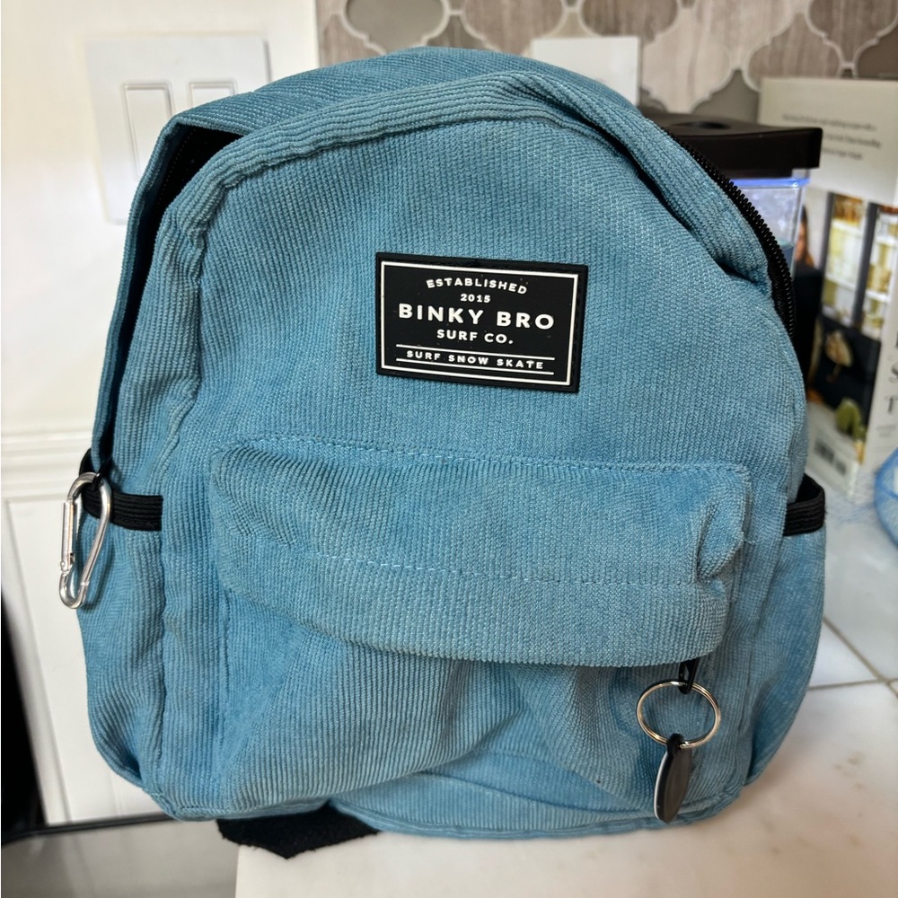 Binky Bro blue cord backpack